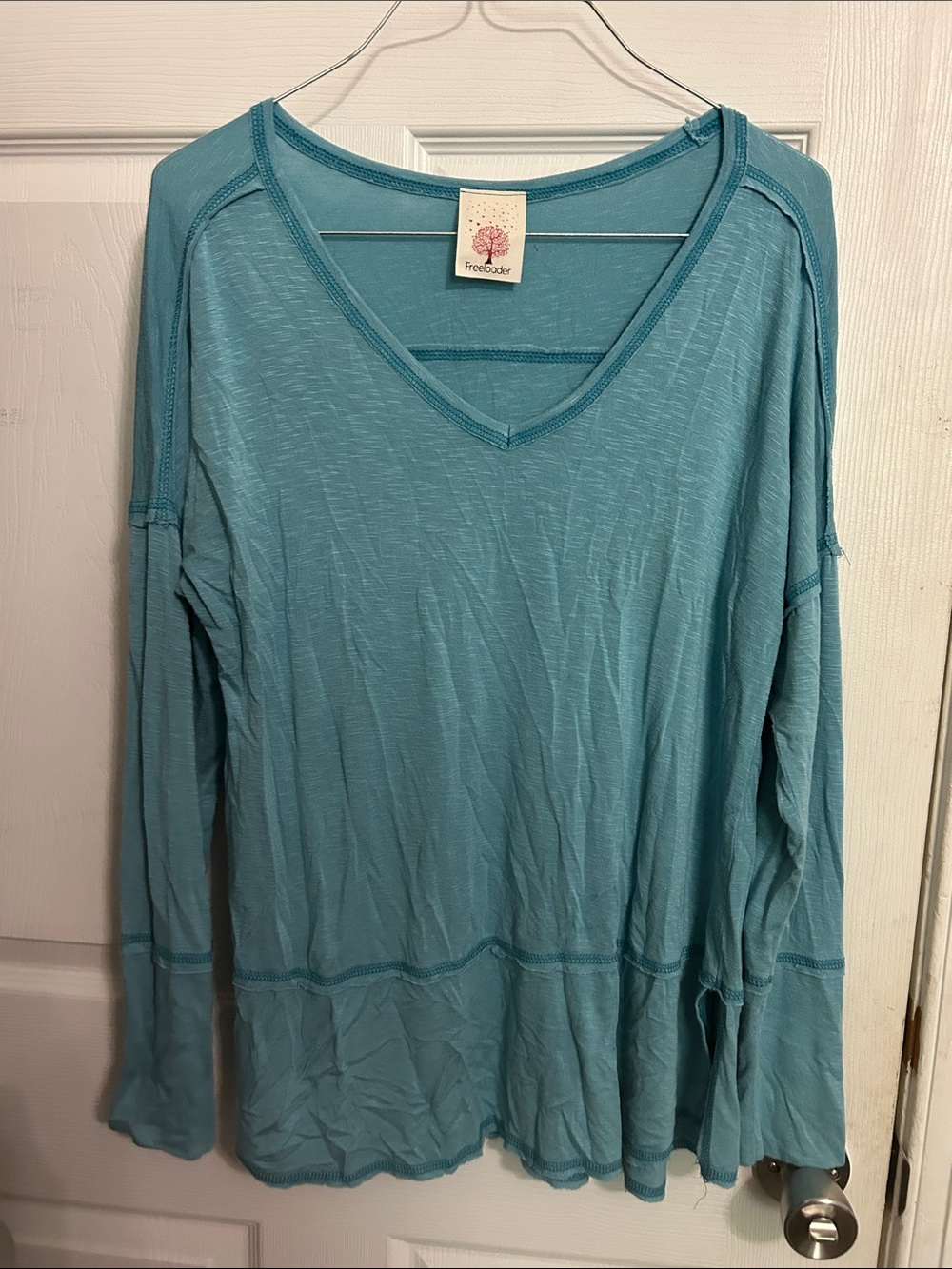 Freeloader Women's V-Neck Long Sleeve Top in Seafoam Blue